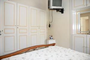 Ліжко або ліжка в номері Neoclassical Splendor Unique Experience in Leros