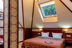 Postel nebo postele na pokoji v ubytování Villa Stanislavskyi Hotel