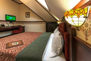 TV a/nebo společenská místnost v ubytování Villa Stanislavskyi Hotel
