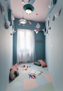 a childs room with a blue room with kites on the floor at COLORS Hotel Athens in Athens