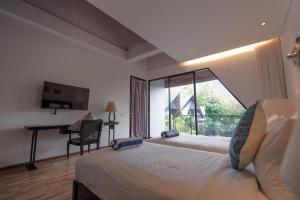 Ένα ή περισσότερα κρεβάτια σε δωμάτιο στο The Lavana Serenity Villa Nusa Dua +20 φωτογραφίες