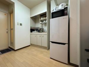 Kuchyň nebo kuchyňský kout v ubytování nestay apartment tokyo itabashi