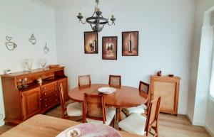 a dining room with a wooden table and chairs at La Panaderia 8 PAX, terraza exterior in Cenicero