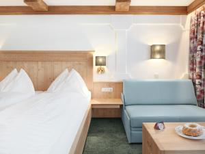 Posteľ alebo postele v izbe v ubytovaní Genuss - und Vitalhotel Moisl