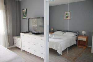 Posteľ alebo postele v izbe v ubytovaní Apartment Brazuca-Center