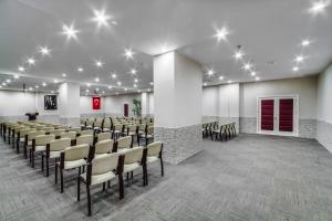a room with a row of chairs in a room at Dedeman Kemer Resort - Ultra All Inclusive in Kemer +78 photos