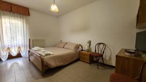 Postel nebo postele na pokoji v ubytování Albergo Meublé Aurora