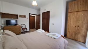 Postel nebo postele na pokoji v ubytování Albergo Meublé Aurora