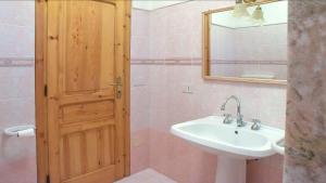 een badkamer met een wastafel en een spiegel bij Sea View, Nature & Barbecue - Authentic "Dammusi" in Pantelleria