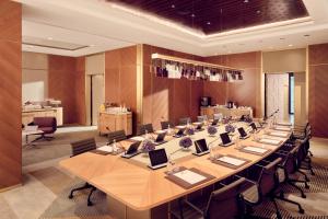 a large conference room with a long table and chairs at Royal Mansour Casablanca in Casablanca
