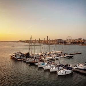 a bunch of boats are docked in the water at Charming sailing boat - Le dimore di Ines in Bari