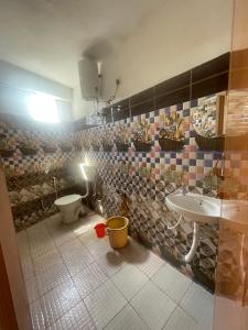 A bathroom at YJS Residency