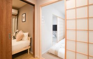 En eller flere senge i et værelse på 和御 汐美・沐美