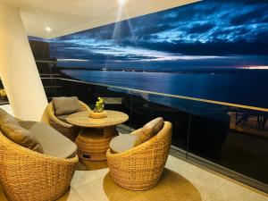 a room with chairs and tables on a cruise ship at Wave Resort&Spa - Top Penthouse in Międzyzdroje