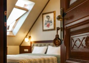 Postel nebo postele na pokoji v ubytování Villa Stanislavskyi Hotel