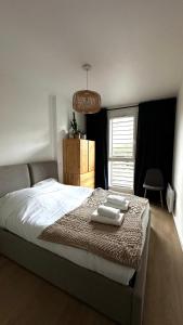 Giường trong phòng chung tại La Suite d'Elisa - Parking, Calme & confort