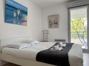 En eller flere senge i et værelse på Duplex Atypique et Central : Les Galets