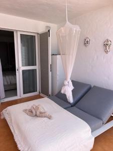 Posteľ alebo postele v izbe v ubytovaní Casa Harmonia mit großer Sonnenterrasse und Meerblick in Top Lage
