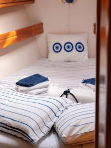 a bedroom with a bed with six olympics on it at Charming sailing boat - Le dimore di Ines in Bari