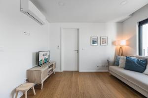 Μια τηλεόραση ή/και κέντρο ψυχαγωγίας στο GuestReady - A Slice of Aveiro