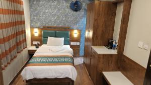 Posteľ alebo postele v izbe v ubytovaní Hotel GRT Square