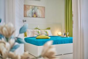 Posteľ alebo postele v izbe v ubytovaní Lefkimmiatis Villas Corfu