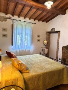 Postel nebo postele na pokoji v ubytování Residence Lucignano