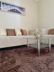 a living room with a couch and a table at Sunset Home 2B (Gated) in Higuey