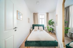 Postel nebo postele na pokoji v ubytování SEVEN Rooms Vienna