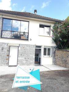 a house with a lease sign in front of it at Du coq à l'âme in Naves