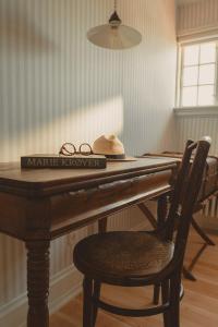 a table with a pair of glasses on top of it at Brøndums Hotel in Skagen