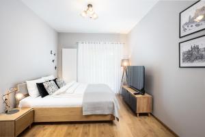 Aparthotel City Break Plac Wolności 6客房内的一张或多张床位