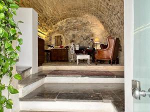 a living room with a chair and a table at neropece in Ragusa