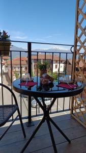 a table on a balcony with food on it at Arduino41 in San Martino Canavese