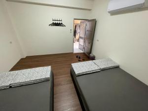 Postel nebo postele na pokoji v ubytování Lanyu Yishanan B&B