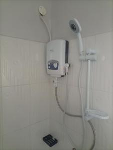 a shower in a bathroom with a shower at Pearl Furnished Rooms Buloba in Kampala