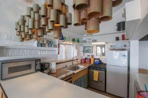 a kitchen with a counter top and some pots and pans at Beachfront on Commercial St Dog Friendly in Provincetown