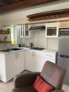 Kuchyň nebo kuchyňský kout v ubytování Le Colonial Cocoon Apartement 2 + 13 fotografií