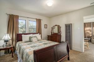 a bedroom with a large bed and a mirror at O'Deer Cabin - Pet Friendly - Estes Park -- EV#3241 cabin in Estes Park +32 photos