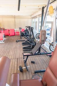 a row of exercise bikes in a gym at Hotel Capitol in Gatteo a Mare