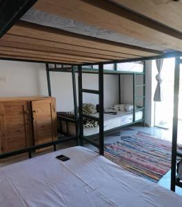 a bedroom with two bunk beds in a room at My Hostel in Dahab - Dive center in Dahab