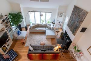 an overhead view of a living room with a couch at Stunning Home with In-Ground Pool in Orleans