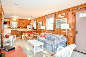 a living room with a couch and a kitchen at 2 mins from Nauset Beach in Orleans