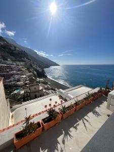 a view of the ocean from a building with plants at Casa Positano in Positano