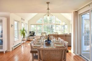 a dining room with a table and chairs at 5-Mins to Forest Beach Dog Friendly in Chatham