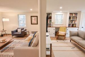 a living room with a couch and a table at Spacious Home with Private In-Ground Pool in Brewster