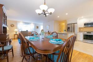a kitchen and dining room with a table and chairs at Spacious Home by Beach Dog Welcome in Brewster +31 photos