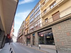 an empty street in front of a building at Alfons I in Puigcerdà