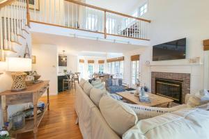 a living room with a couch and a fireplace at In-Ground Plunge Pool Dog Friendly! in Brewster