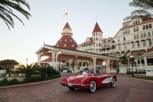 a red car parked in front of a building at Hotel del Coronado, Curio Collection by Hilton in San Diego